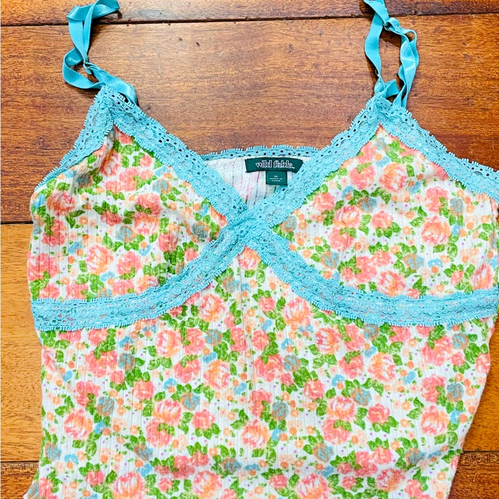 Low cut and cropped camisole.